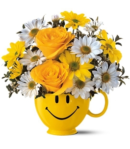 Flowers placed on a smiley vase